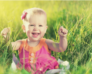 baby girl in grass