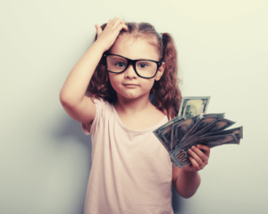 girl holding money