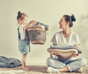 mom & daughter folding laundry